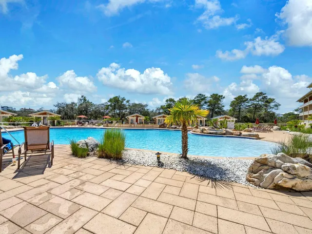 a view of a patio with swimming pool