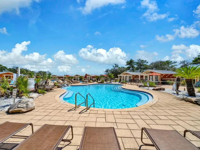 a view of a balcony with furniture