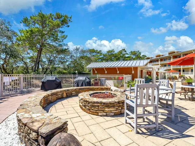 a view of a swimming pool with an outdoor seating