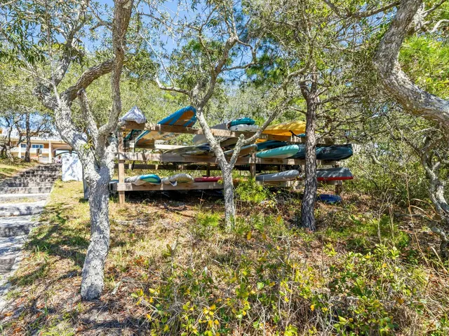 a swimming pool with outdoor seating and city view