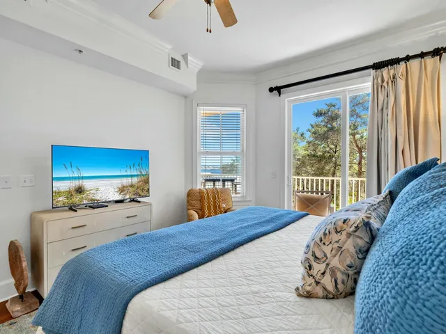 a bedroom with a large bed and a window