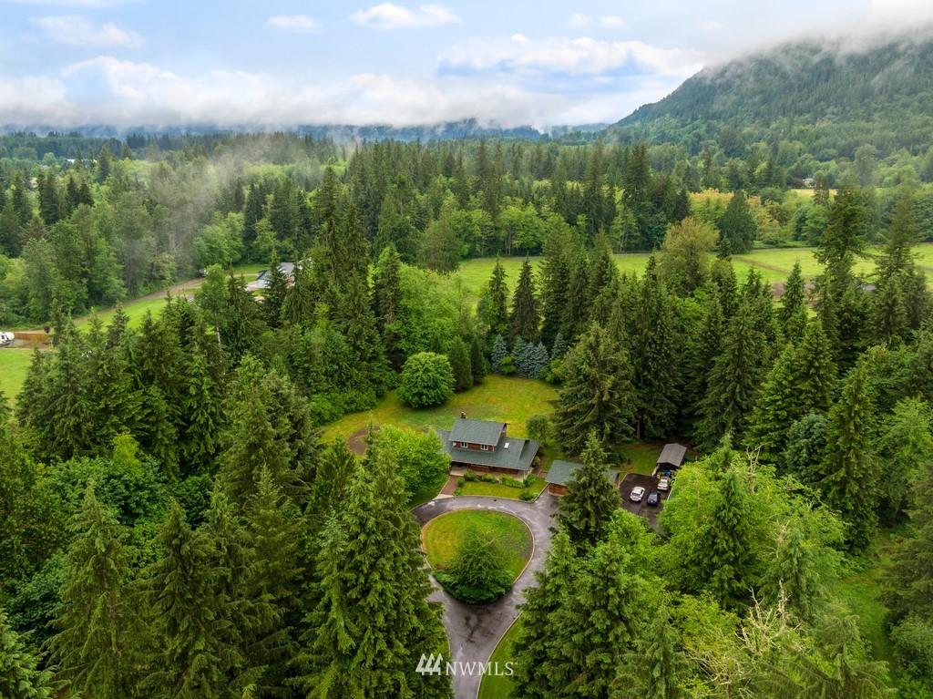 23402 Wallitner Road Arlington, WA 98223 - Photo 15 of 39 a view of a garden with mountains in the background