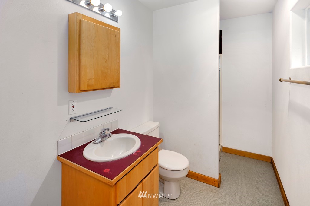 23402 Wallitner Road Arlington, WA 98223 - Photo 26 of 39 a bathroom with a toilet sink and mirror