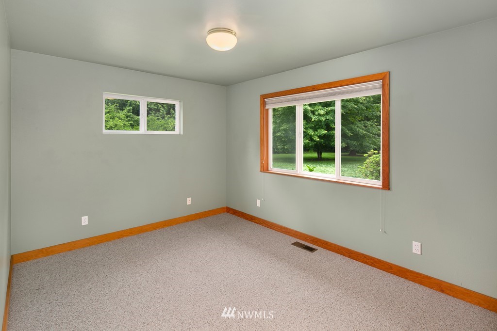 23402 Wallitner Road Arlington, WA 98223 - Photo 30 of 39 an empty room with a window