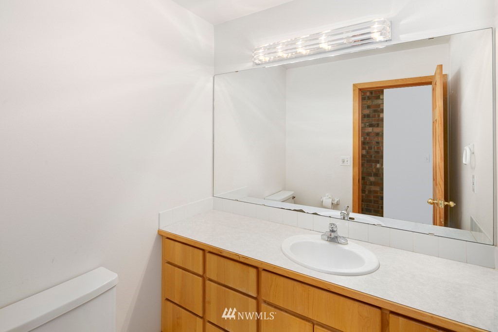 23402 Wallitner Road Arlington, WA 98223 - Photo 31 of 39 a bathroom with a sink and a mirror