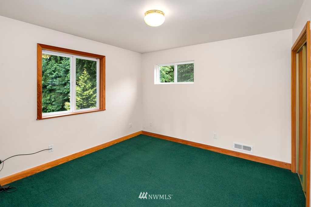 23402 Wallitner Road Arlington, WA 98223 - Photo 35 of 39 a view of an empty room with a window