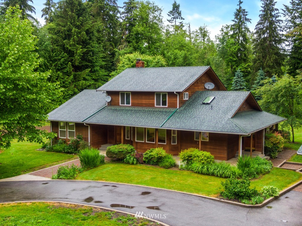 23402 Wallitner Road Arlington, WA 98223 - Photo 7 of 39 a aerial view of a house next to a yard