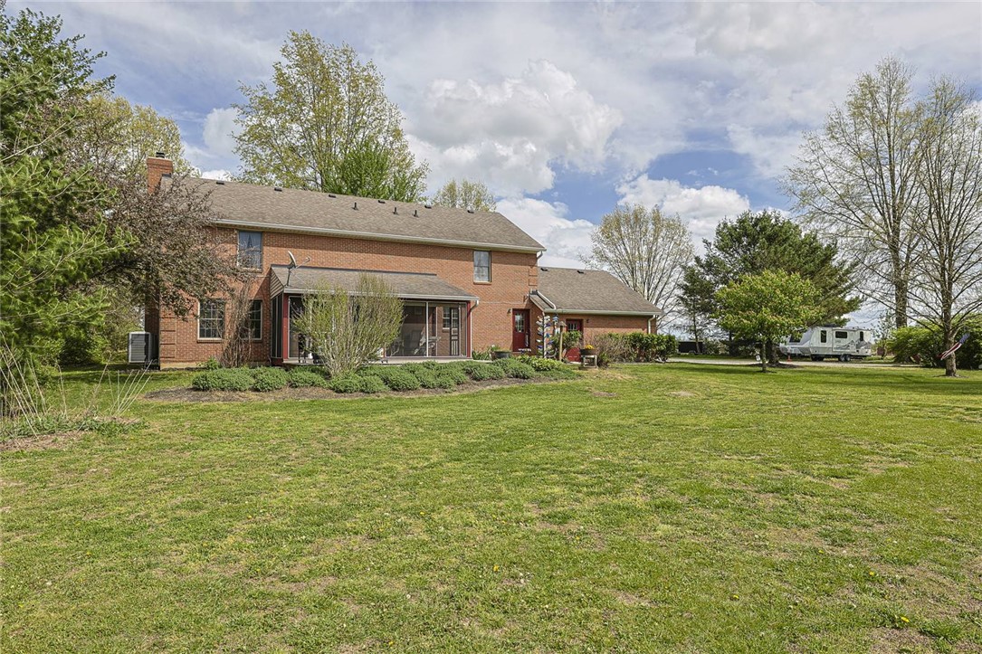 1757 Phillips Road Lebanon, OH 45036 - Photo 30 of 51 This spacious property offers expansive green space, mature trees, and a classic brick residence with an inviting porch.