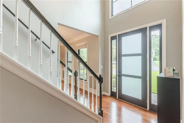 a view of an entryway with wooden floor
