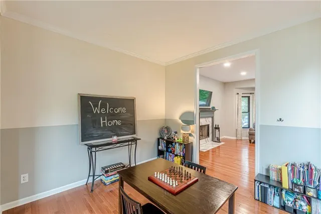 a living room with furniture and a book shelf