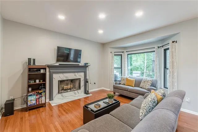 a living room with furniture and a fireplace