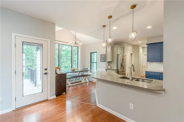 a view of backyard with outdoor seating and plants