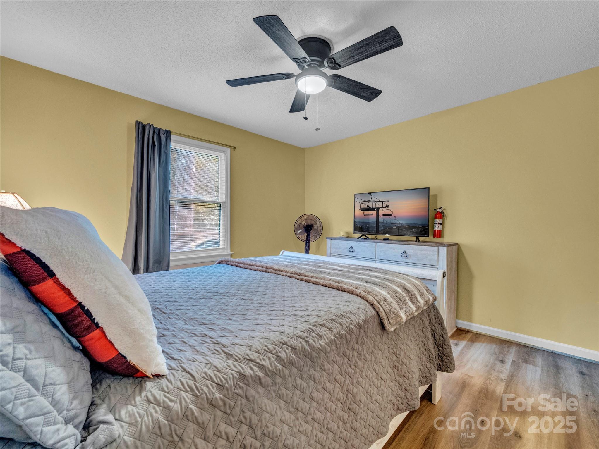 5349 Hickory Nut Gap Road Newland, NC 28657 - Photo 16 of 34 a bedroom with bed and window