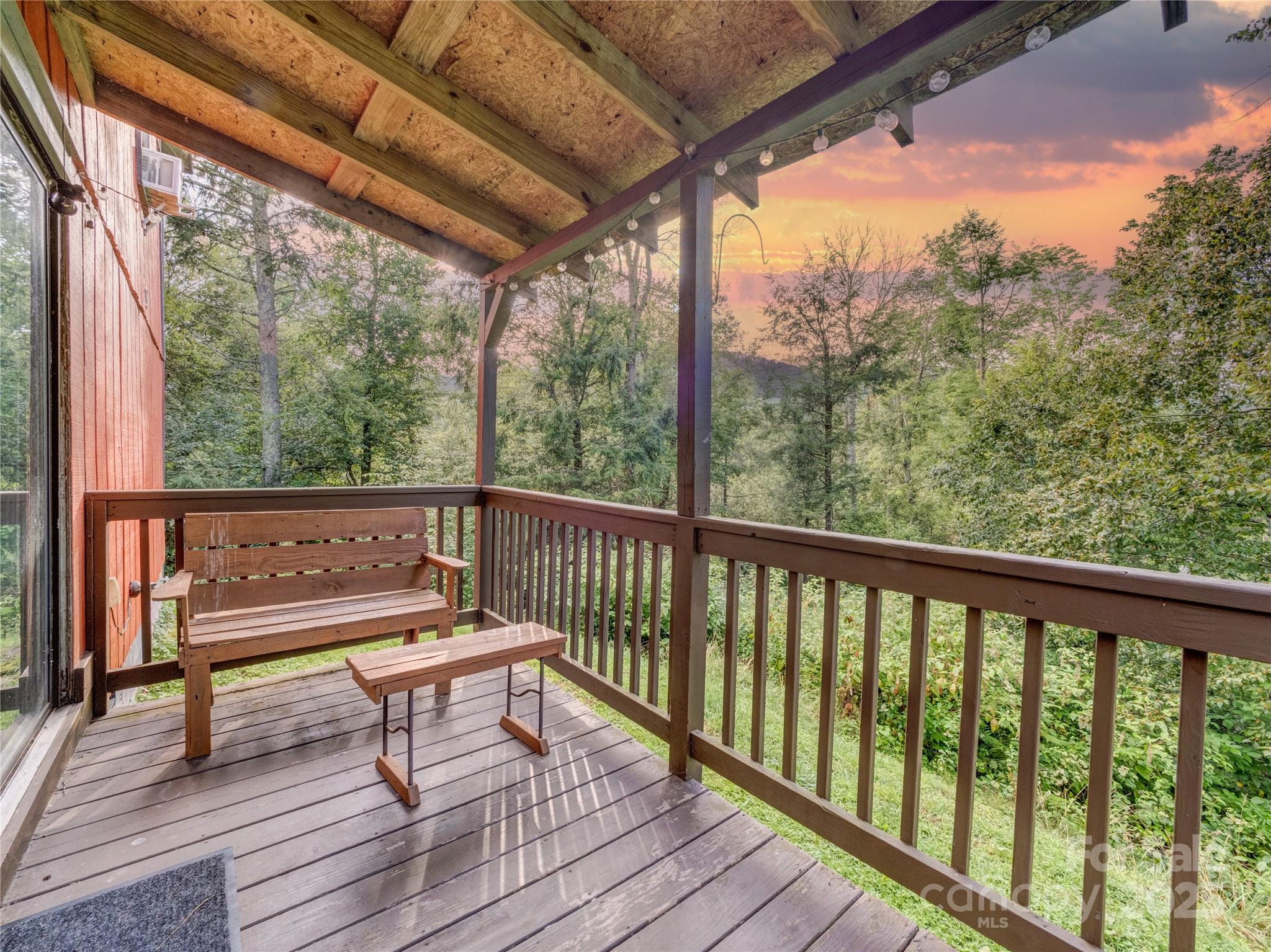5349 Hickory Nut Gap Road Newland, NC 28657 - Photo 32 of 34 a view of a two chairs in the deck