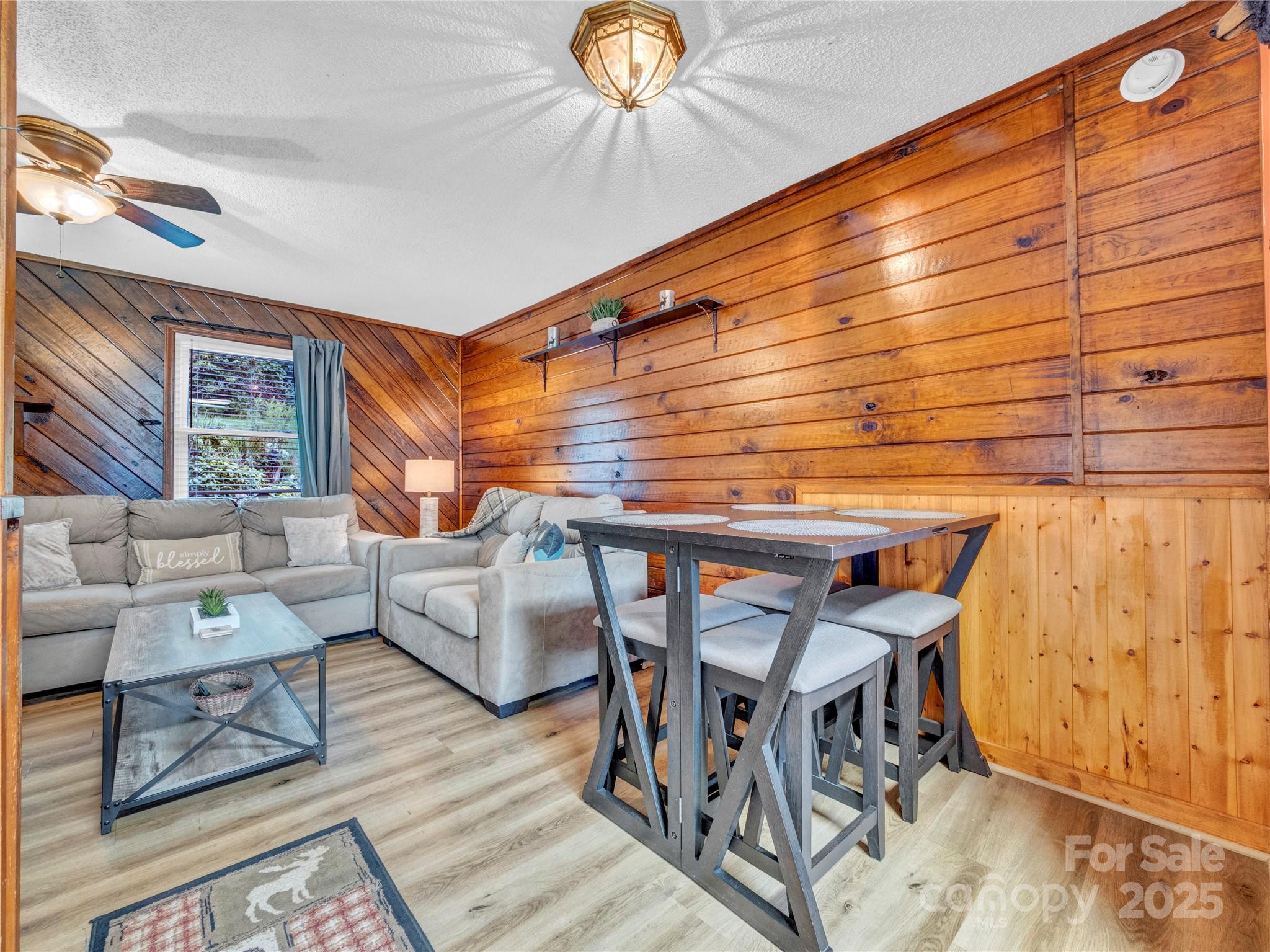 5349 Hickory Nut Gap Road Newland, NC 28657 - Photo 5 of 34 a roof deck with couch and chairs