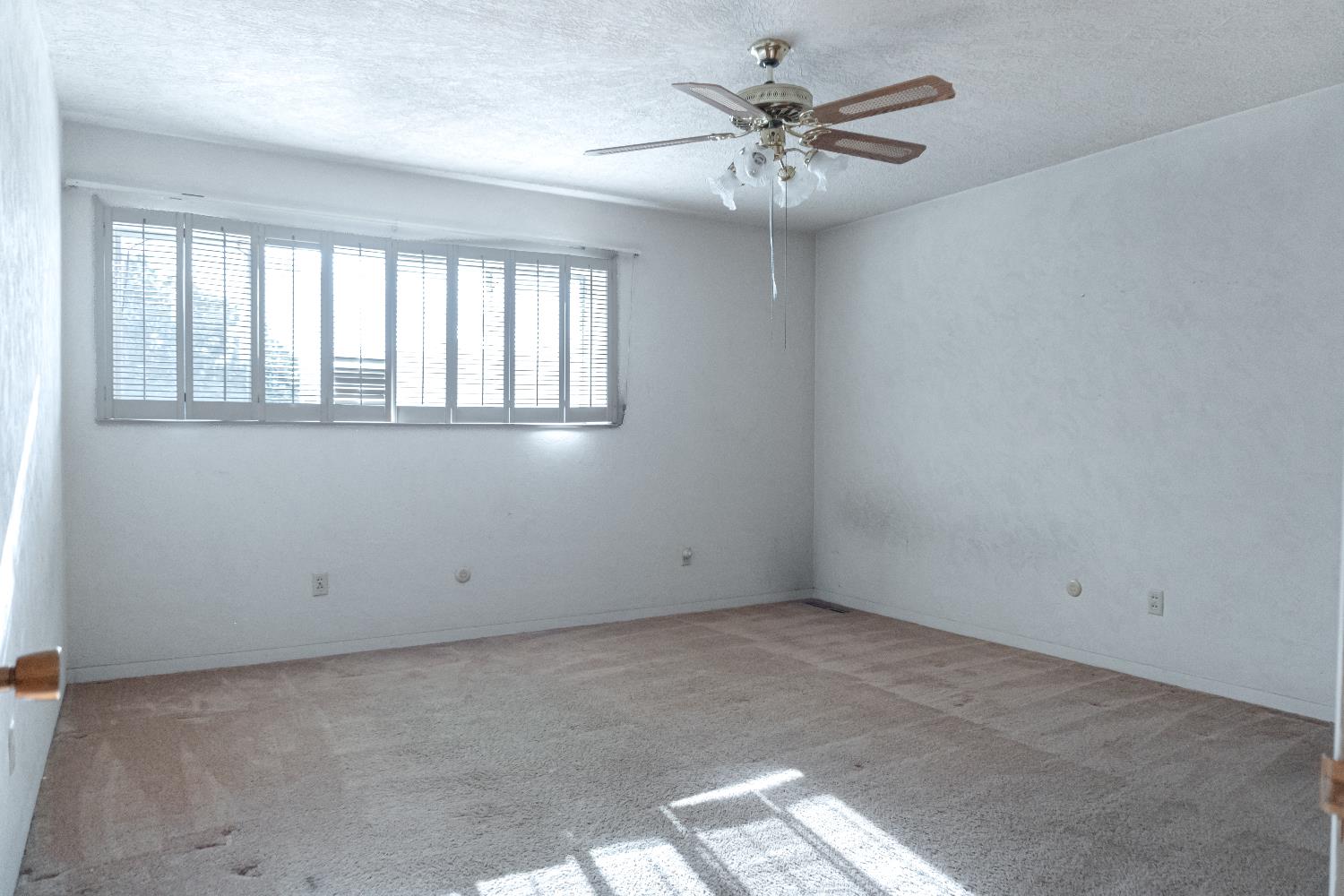 5877 East Dwight Way Fresno, CA 93727 - Photo 14 of 31 an empty room with a window