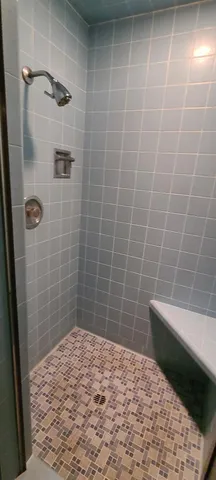 a kitchen with a refrigerator and a sink