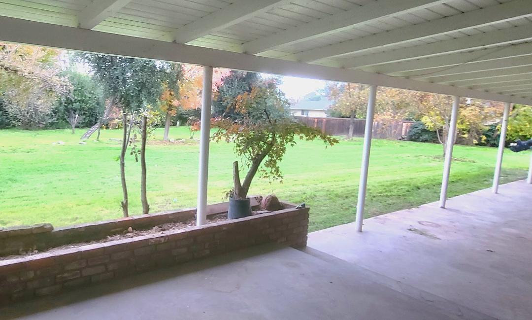 5877 East Dwight Way Fresno, CA 93727 - Photo 24 of 31 a view of a yard with porch and garden