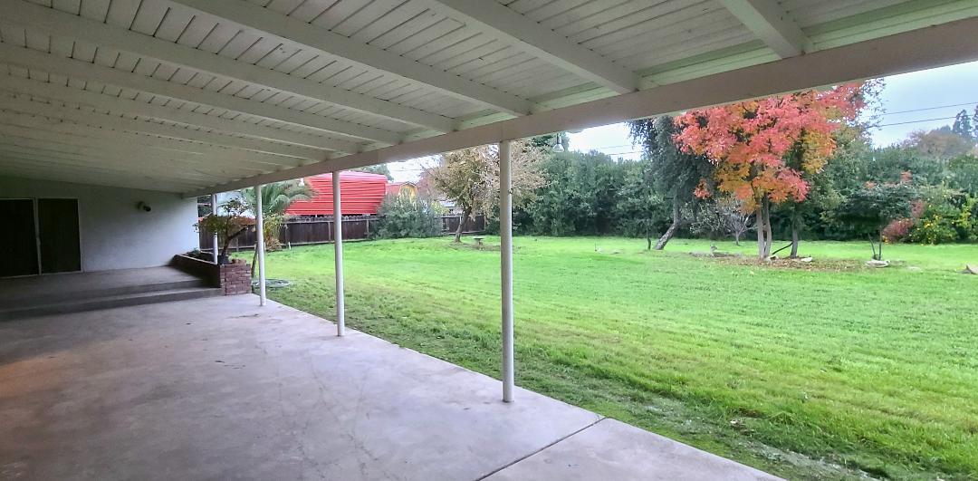 5877 East Dwight Way Fresno, CA 93727 - Photo 26 of 31 a view of a house with backyard