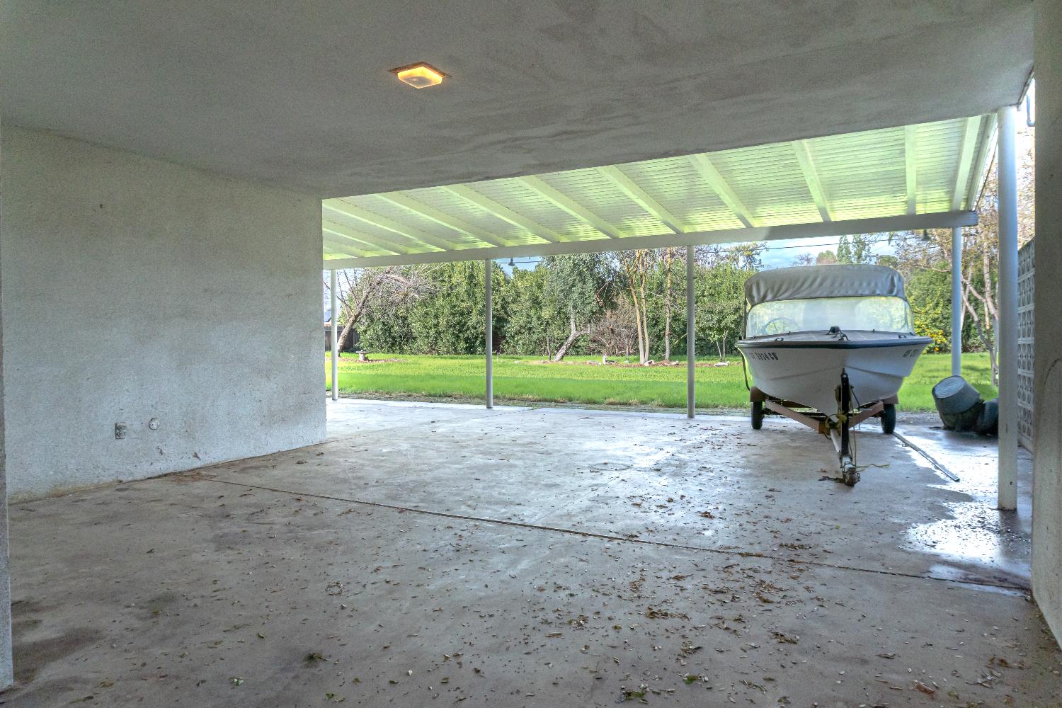 5877 East Dwight Way Fresno, CA 93727 - Photo 28 of 31 a view of a porch with furniture and garden