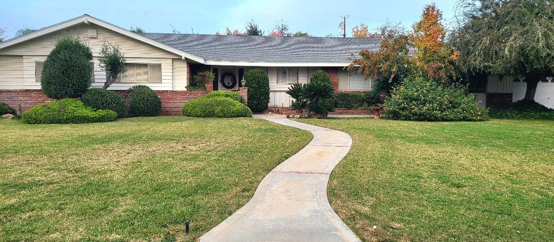 5877 East Dwight Way Fresno, CA 93727 - Photo 30 of 31 a view of a house with backyard and garden