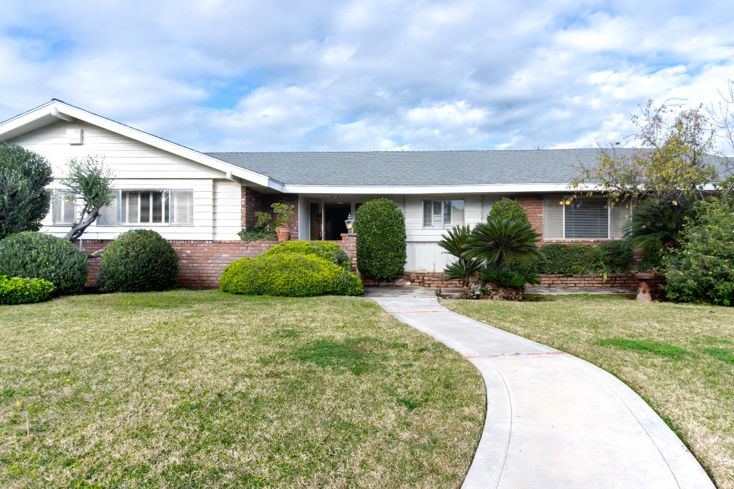 5877 East Dwight Way Fresno, CA 93727 - Photo 31 of 31 a house view with a garden space
