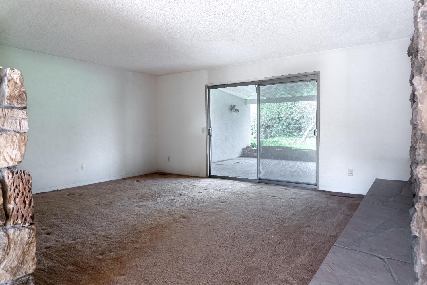 5877 East Dwight Way Fresno, CA 93727 - Photo 10 of 31 an empty room with floor to ceiling window