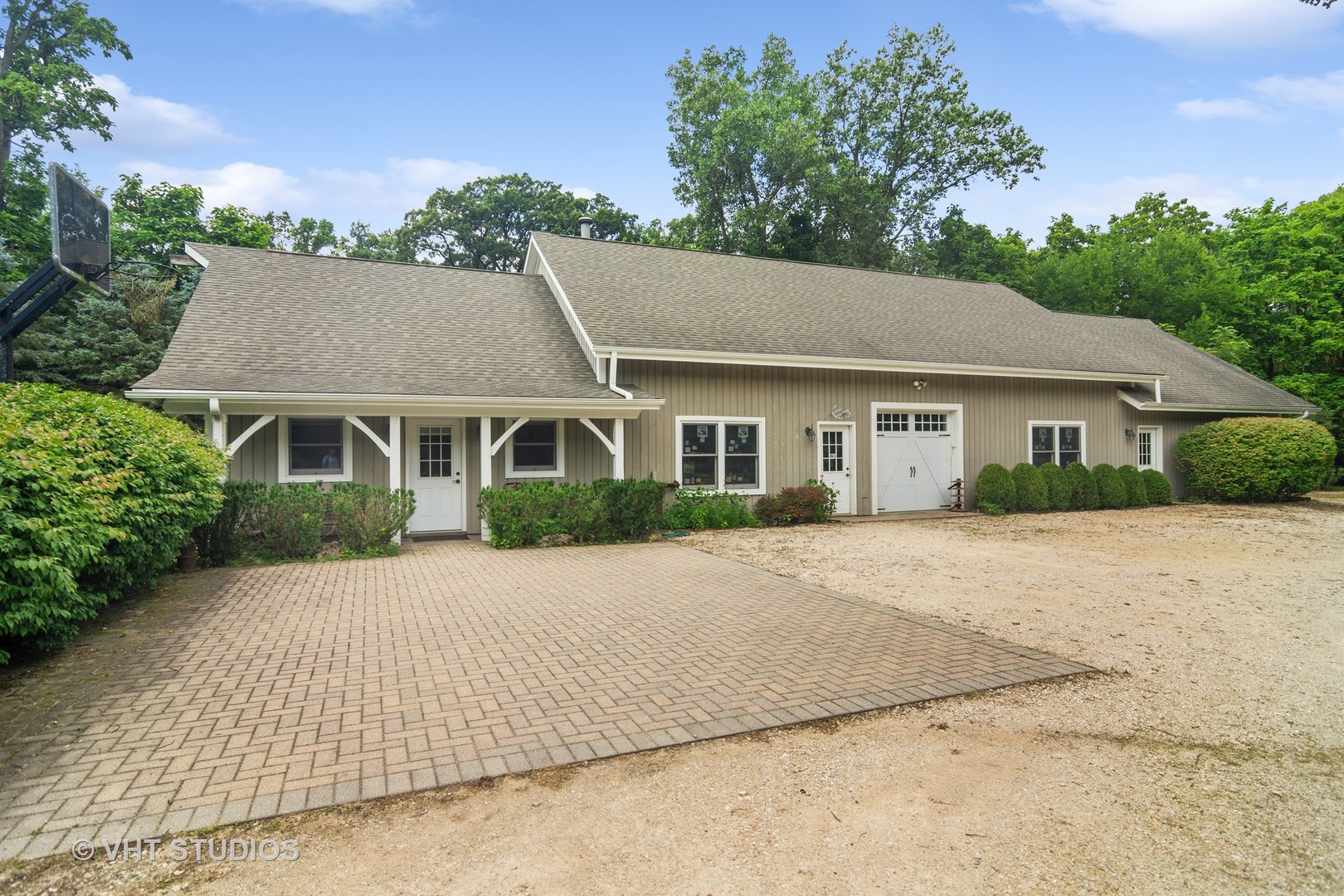 27282 West Cuba Road Barrington, IL 60010 - Photo 23 of 45 a front view of a house with a garden