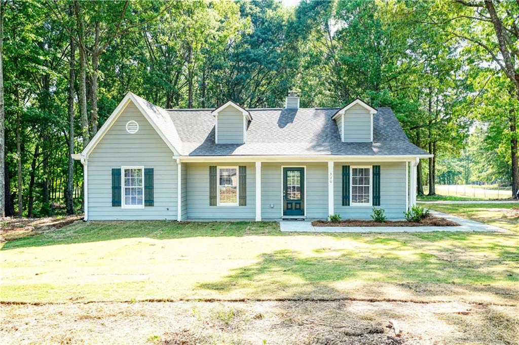 330 Cowan Road Covington, GA 30016 - Photo 1 of 1 a view of a house with a yard and sitting area