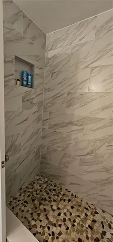 a bathroom with a sink vanity and mirror