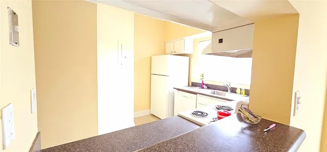 a utility room with sink dryer and washer