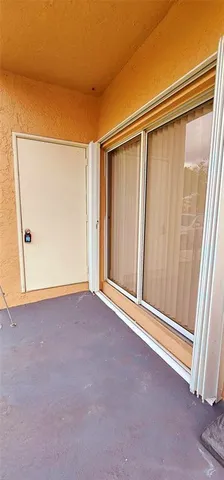 a front view of a house with plants