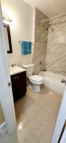 a bathroom with a sink vanity and mirror