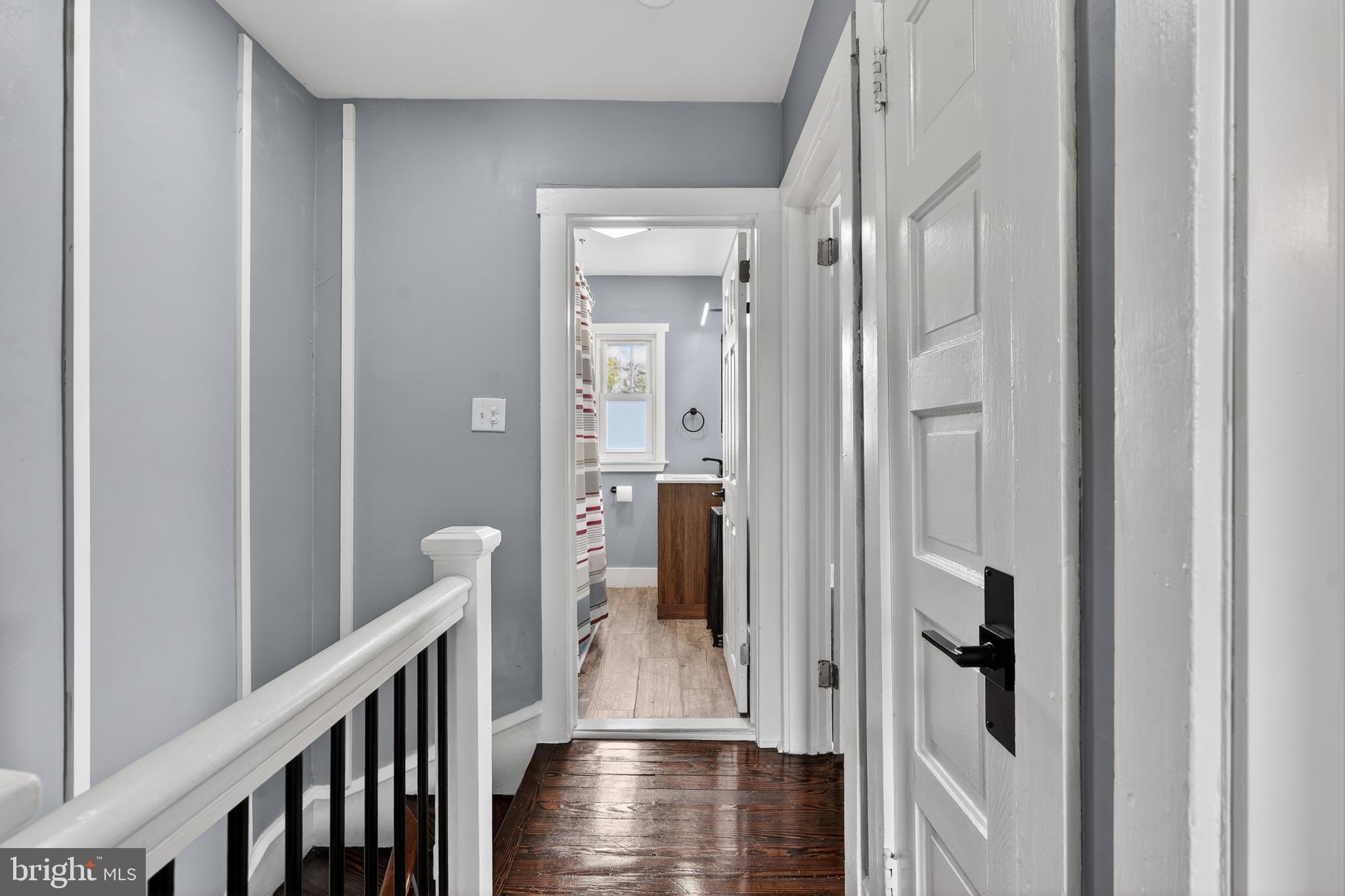 223 Noreg Place Brooklawn, NJ 08030 - Photo 31 of 36 a view of a hallway with wooden floor and staircase