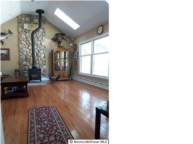 606 Freehold Road Jackson, NJ 08527 - Photo 1 of 3 a view of livingroom with furniture and window