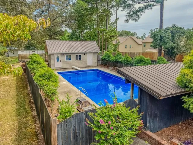 a view of a yard with an outdoor space