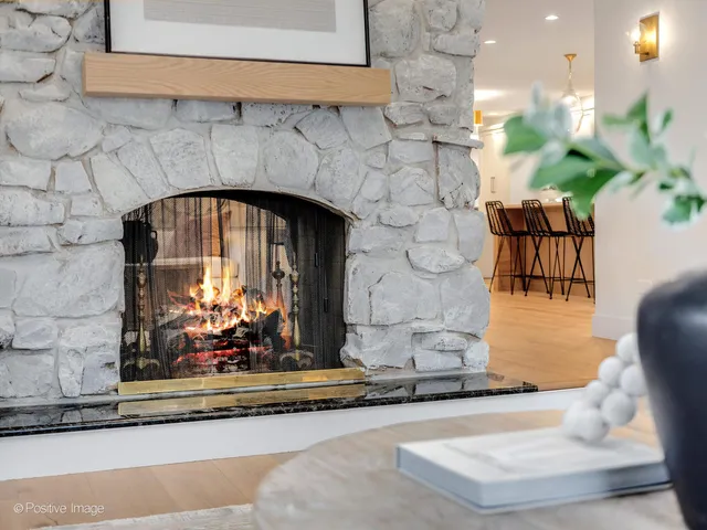 a kitchen with a table chairs stove and cabinets