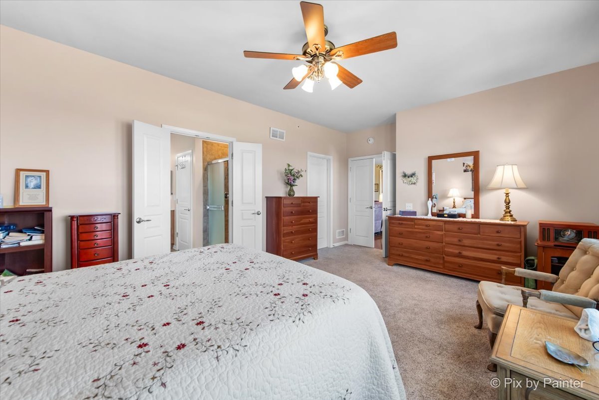 12290 Russet Lane Huntley, IL 60142 - Photo 18 of 38 a bedroom with a bed and a dresser