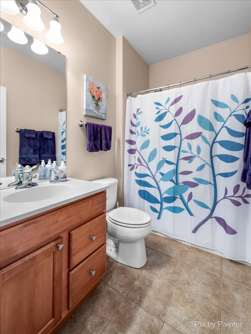 12290 Russet Lane Huntley, IL 60142 - Photo 23 of 38 a bathroom with a granite countertop sink mirror vanity and toilet