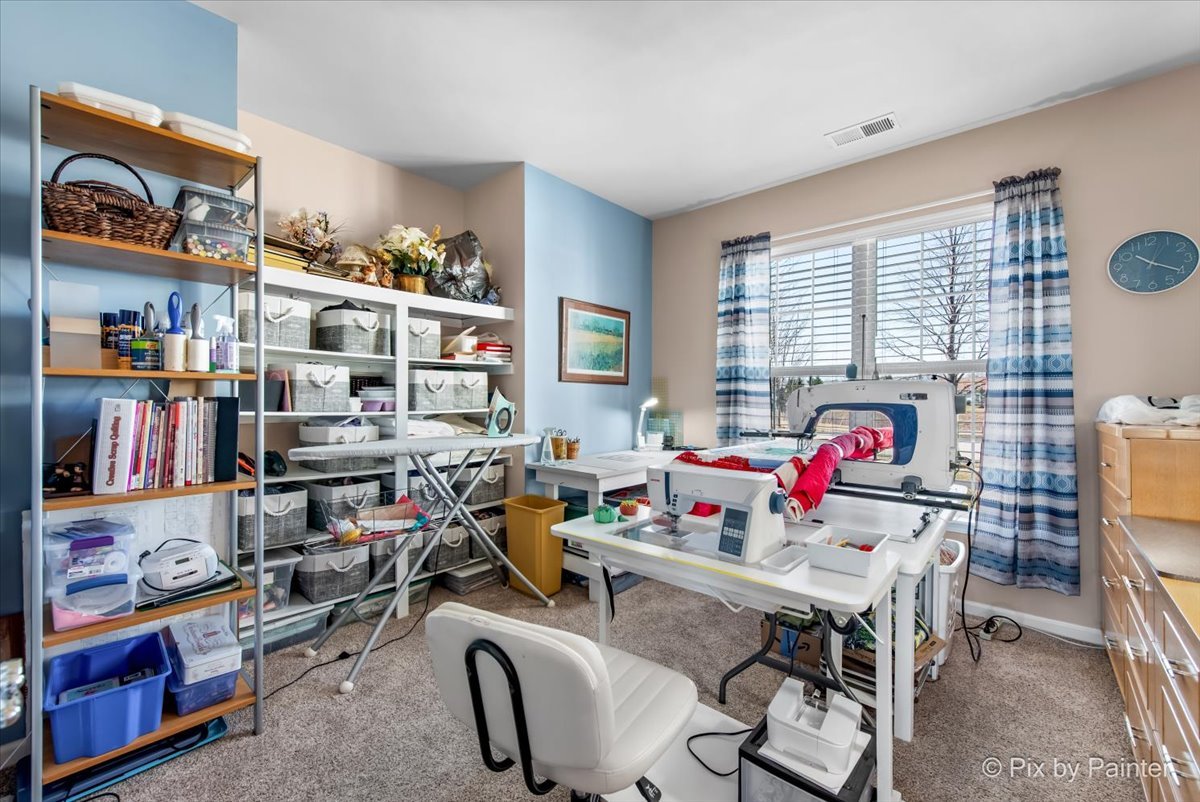 12290 Russet Lane Huntley, IL 60142 - Photo 24 of 38 a view of a workspace with furniture and a window