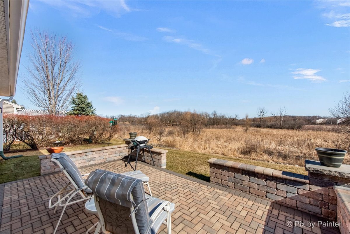 12290 Russet Lane Huntley, IL 60142 - Photo 28 of 38 a view of a lake with a terrace