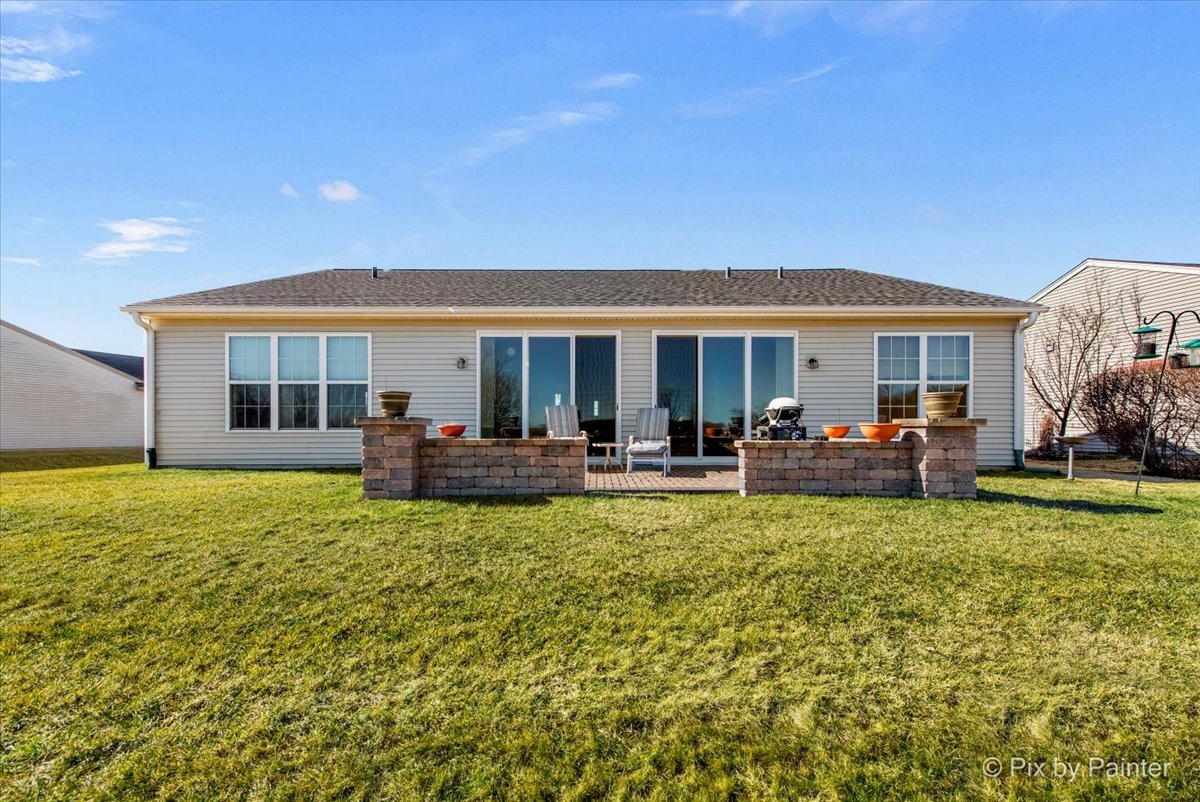 12290 Russet Lane Huntley, IL 60142 - Photo 30 of 38 a view of a house with swimming pool and porch