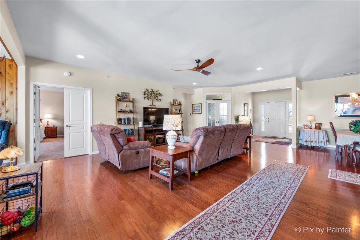 12290 Russet Lane Huntley, IL 60142 - Photo 7 of 38 a living room with furniture and a wooden floor