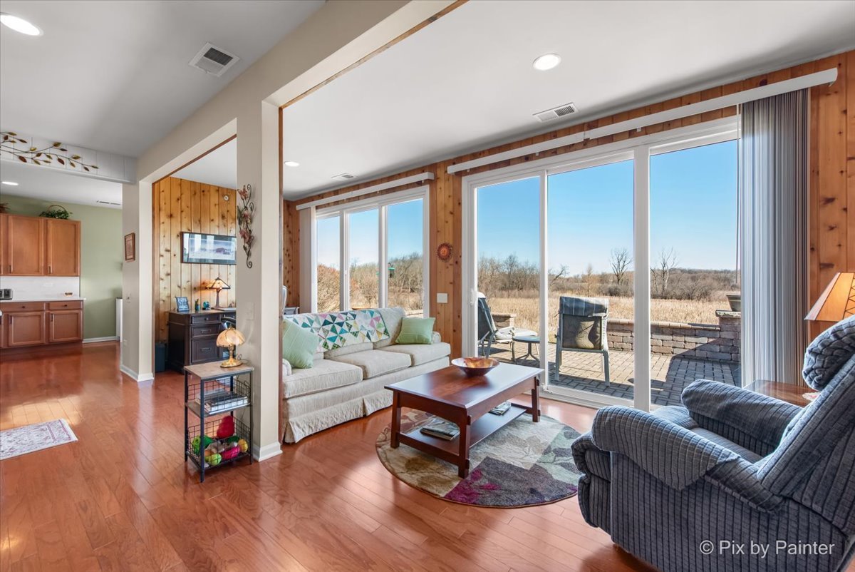 12290 Russet Lane Huntley, IL 60142 - Photo 9 of 38 a living room with furniture and a large window