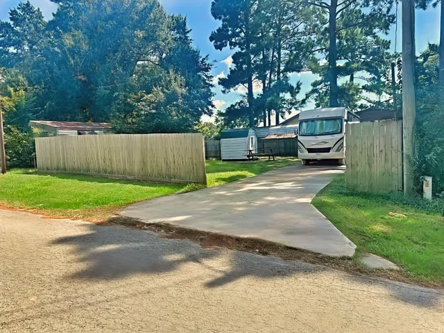 a view of a backyard with a small cabin