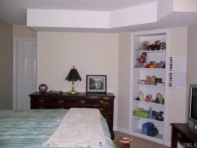 990 Templeridge Road Wake Forest, NC 27587 - Photo 6 of 7 a bedroom with a bed and a dresser