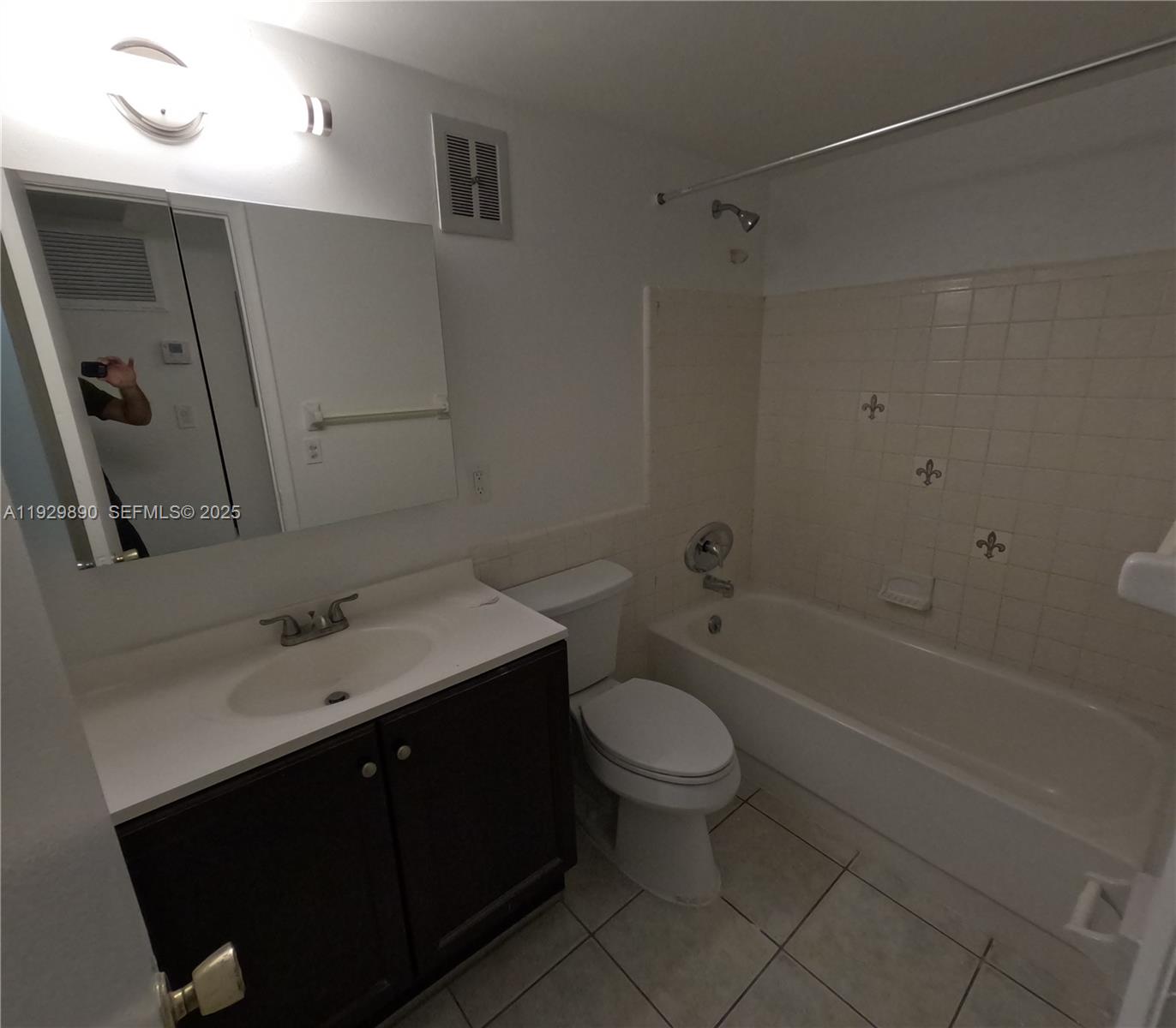 1010 Southeast 15th Street, Unit 209 Fort Lauderdale, FL 33316 - Photo 7 of 10 a bathroom with a sink a toilet and shower