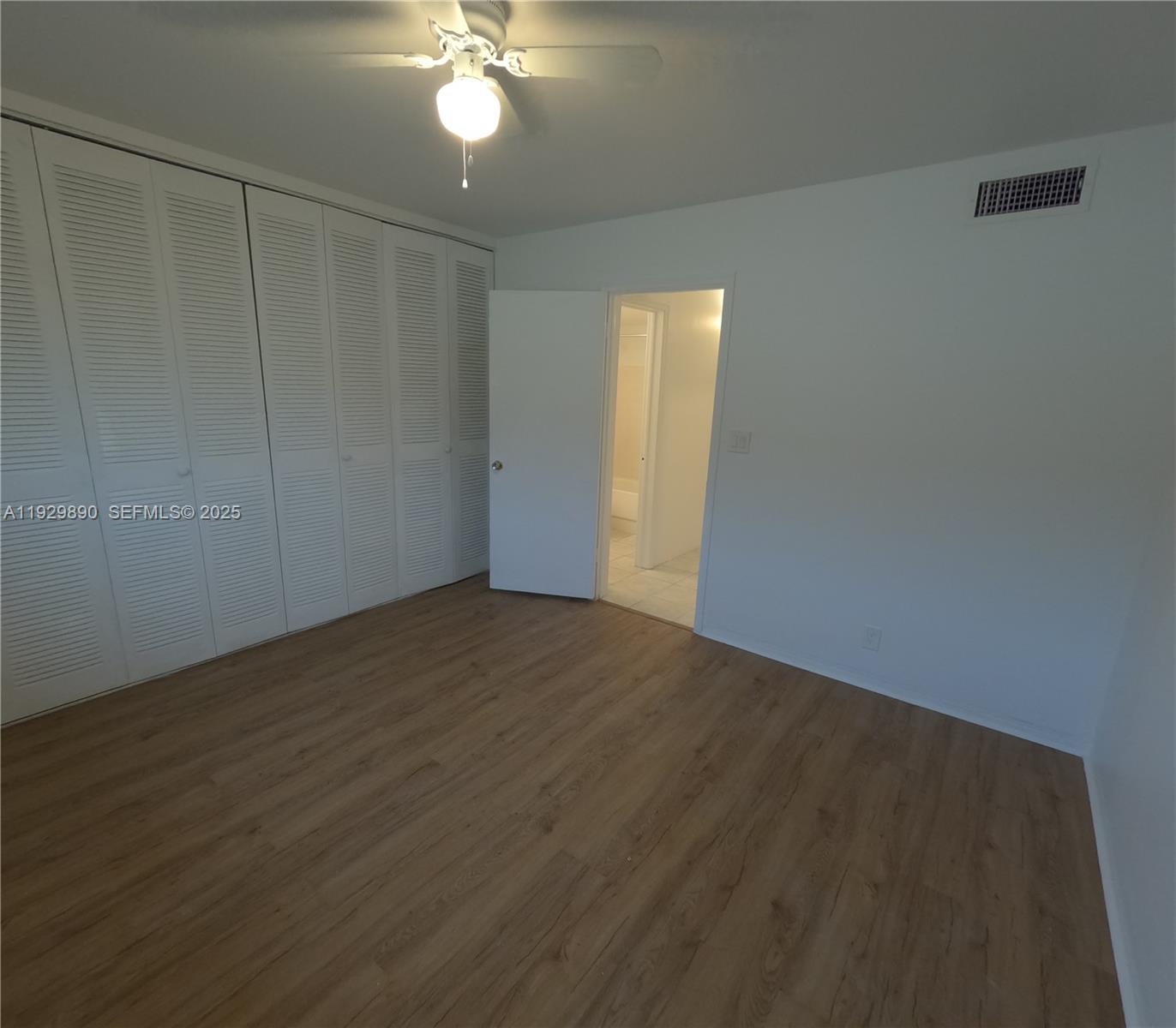 1010 Southeast 15th Street, Unit 209 Fort Lauderdale, FL 33316 - Photo 9 of 10 a view of an empty room with wooden floor