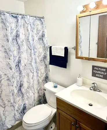 a bathroom with a sink and a toilet