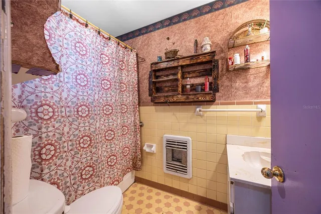 a bedroom with furniture and a fireplace